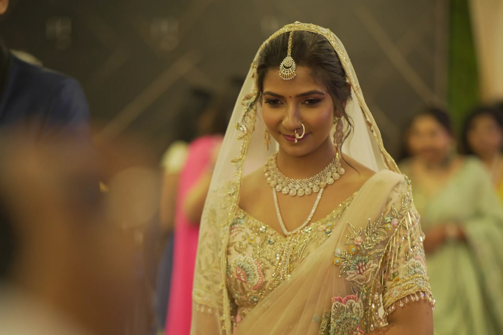 Bride in cream beneath her veil